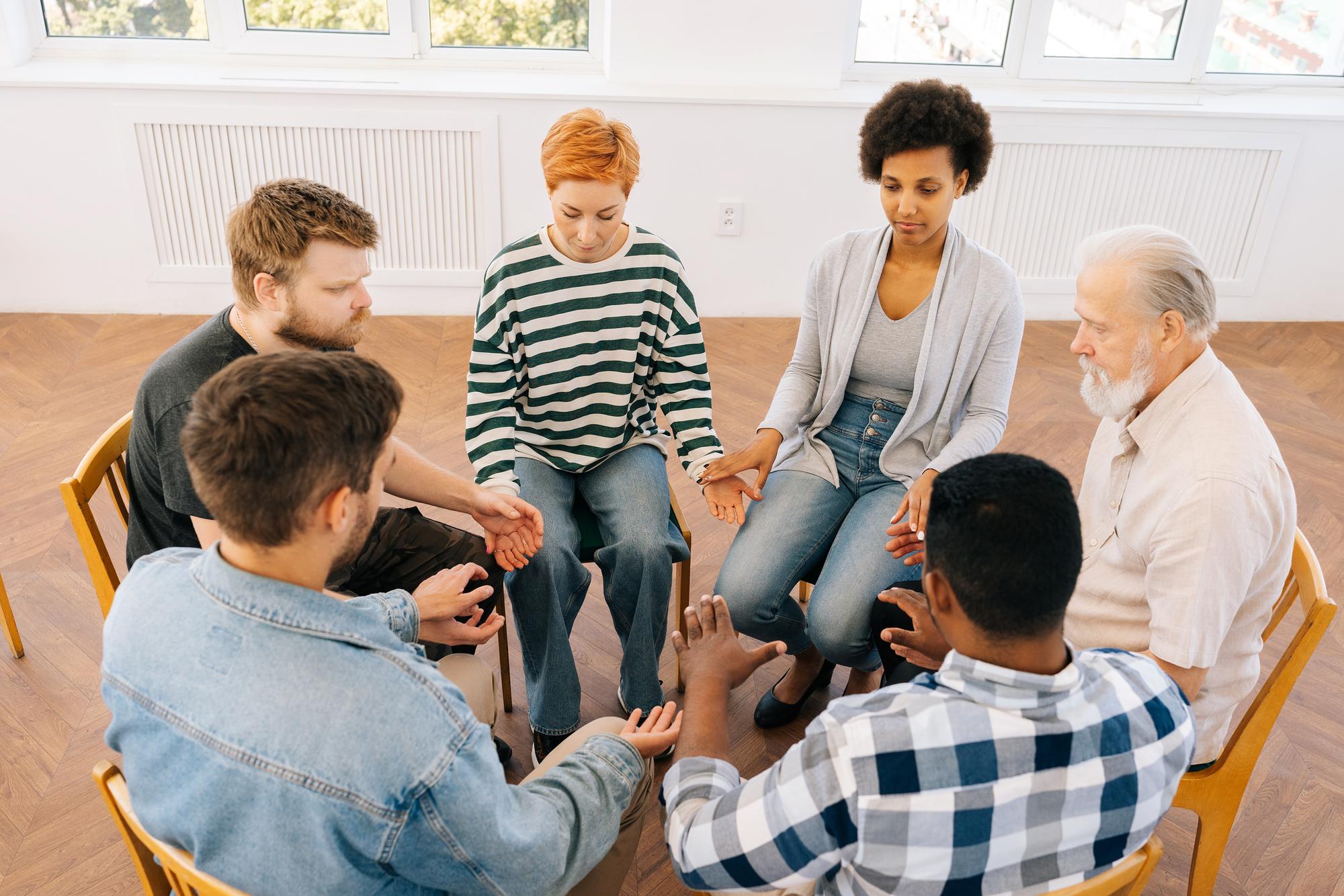 Muslim women in supportive conversation, mental health program